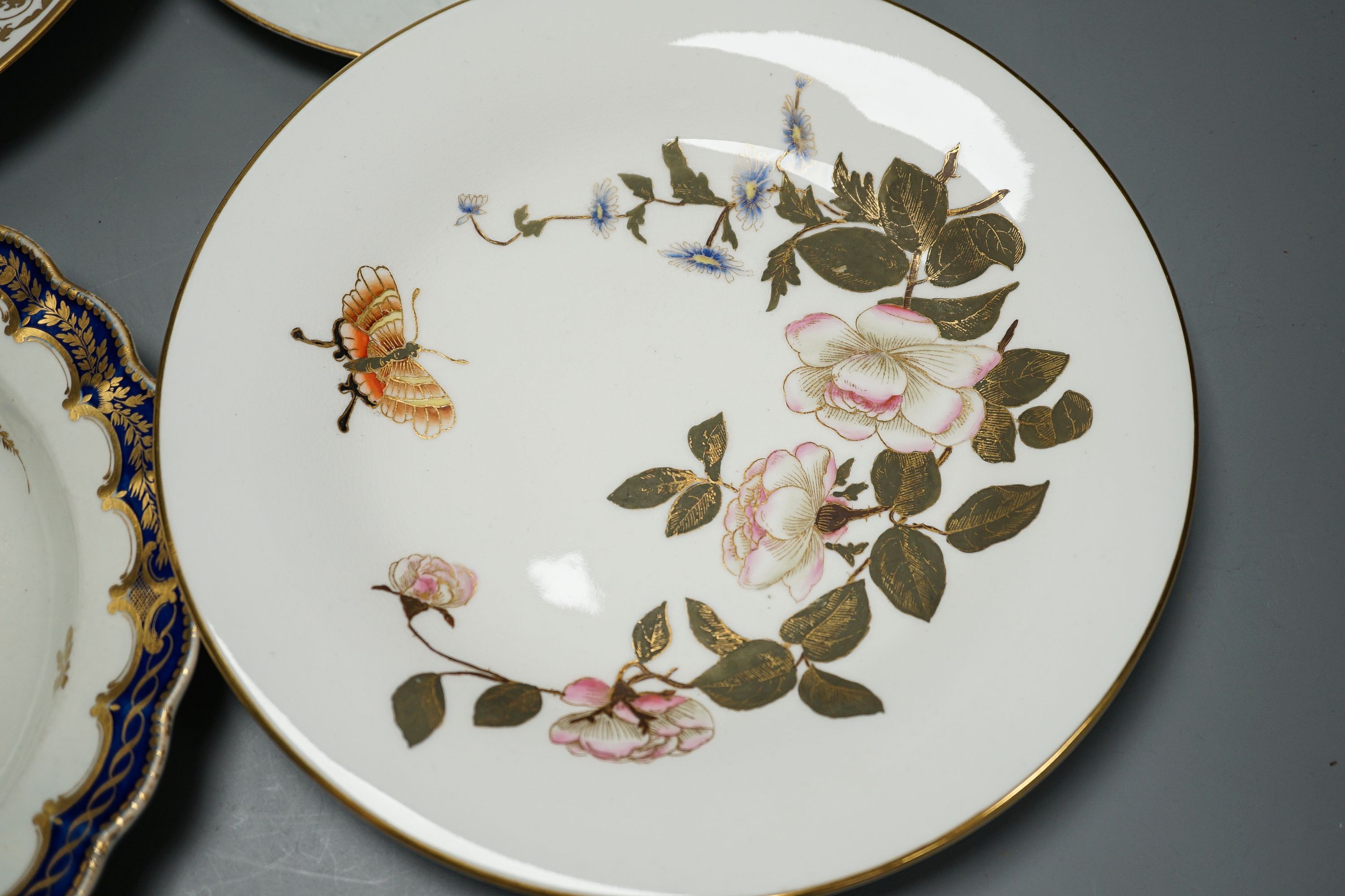 18th/19th century cabinet plates - A rare early Coalport landscape dessert plate, c.1805-10, a Coalport style plate, a Worcester blue and gilt foliate dish, c. 1790 and a pair of Royal Worcester dishes (5)